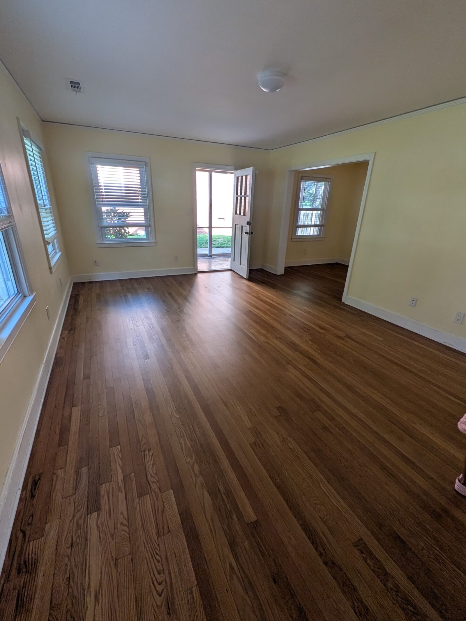 Finished hardwood floor with entry door